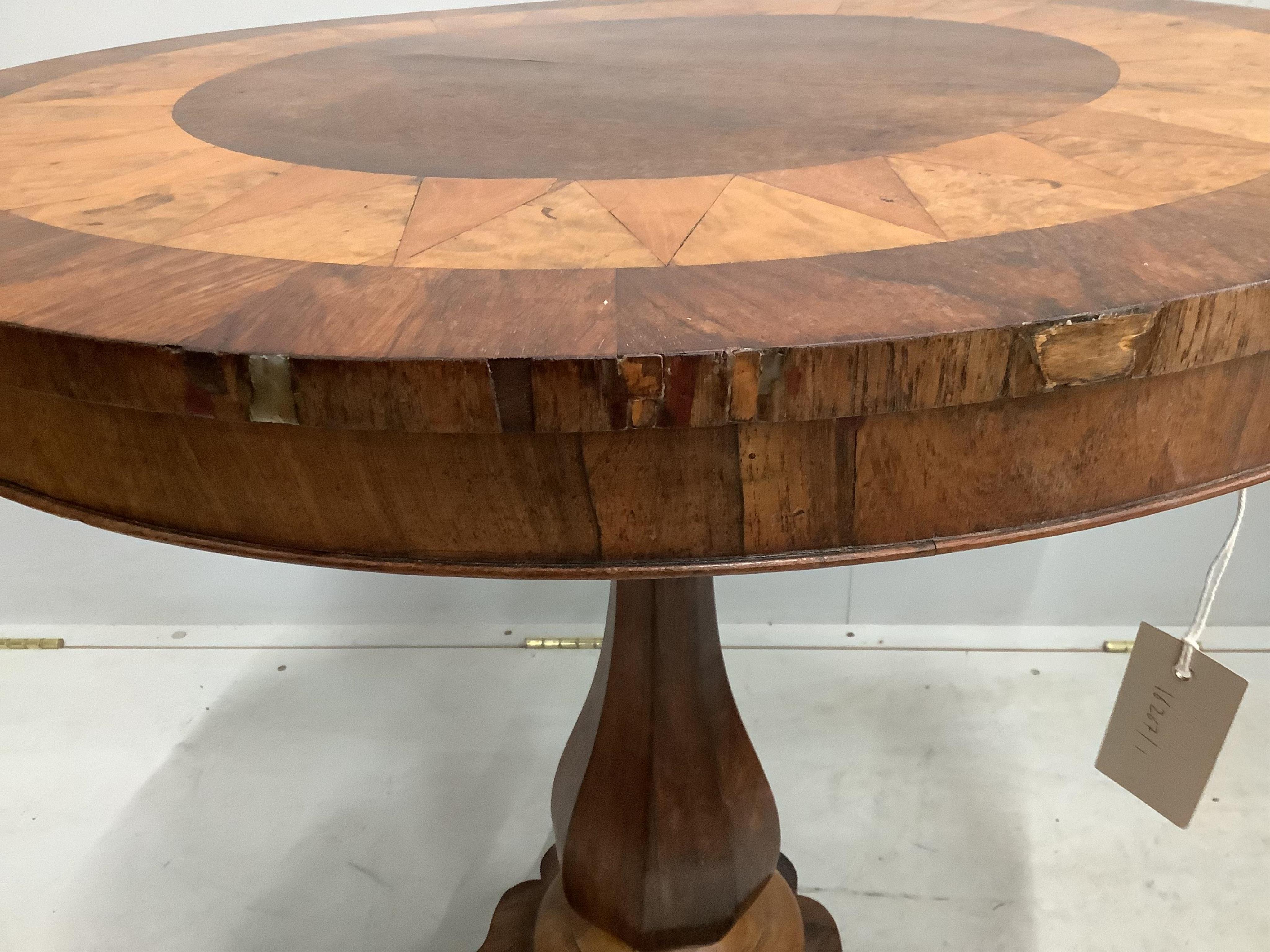 An early 19th century Continental rosewood, walnut and satinwood centre table, with parquetry top, diameter 76cm, height 75cm. Condition - fair to good